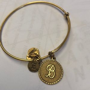 Brass colored Alex and Ani B bracelet.